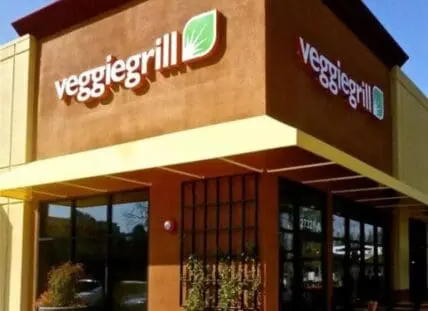 Exterior of Veggie Grill restaurant with signage and entrance