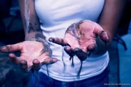 Hands holding soil and a seedling, illustrating sustainable agriculture and food production