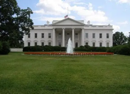 The White House's north facade with fountain and red flower garden