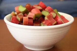 Diced rhubarb pieces in a white bowl