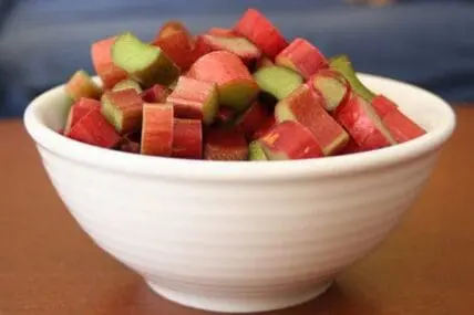 Diced rhubarb pieces in a white bowl