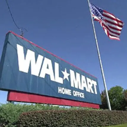 Walmart Home Office building with American flag against blue sky