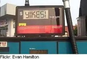 Gas price sign displaying high fuel costs at a service station