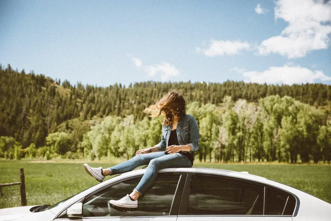 girl on top of car, she probably drinks chlorella smoothies because of all of the health benefits of chlorella
