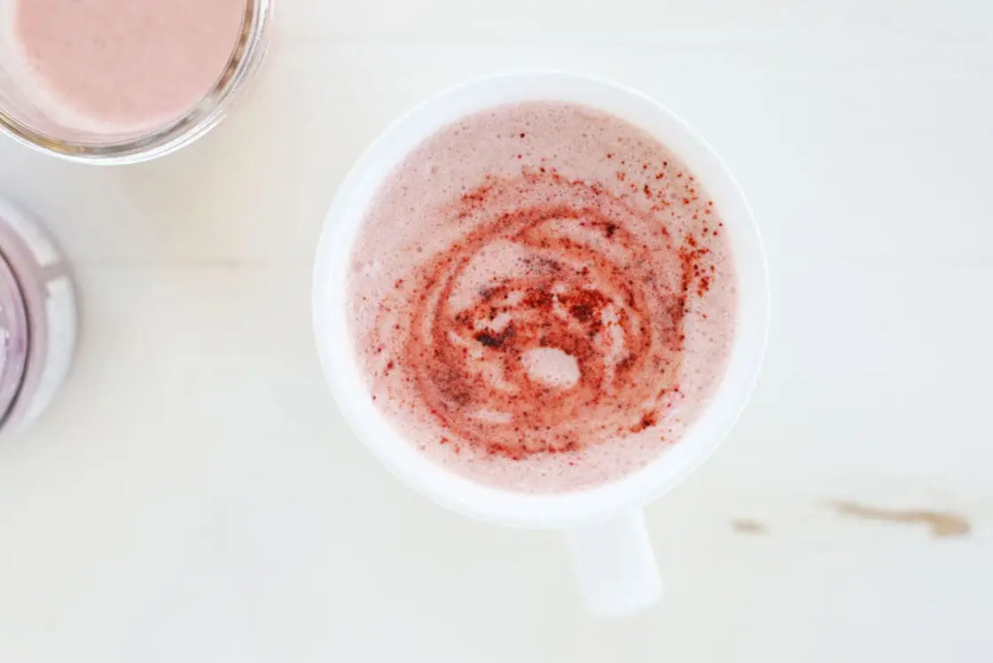 pretty pink beetroot latte in a white cup