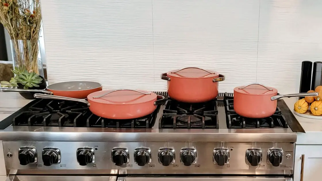 image of Carway's Perracotta cookware on Laura Klein's stovetop. Caraway cookware is one of the highest quality ceramic coated safe cookware brands on the market. They are a top pick of the bunch.