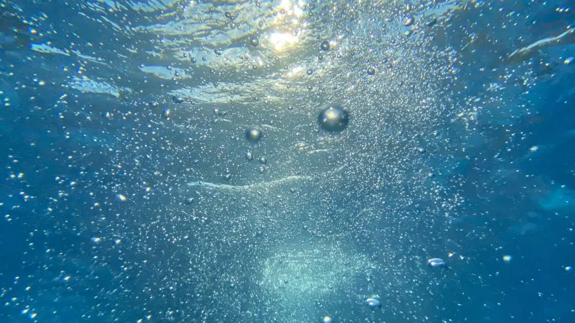 bubbly water swimming. collagen peptides and collagen supplements may help health gut and digestion issues.