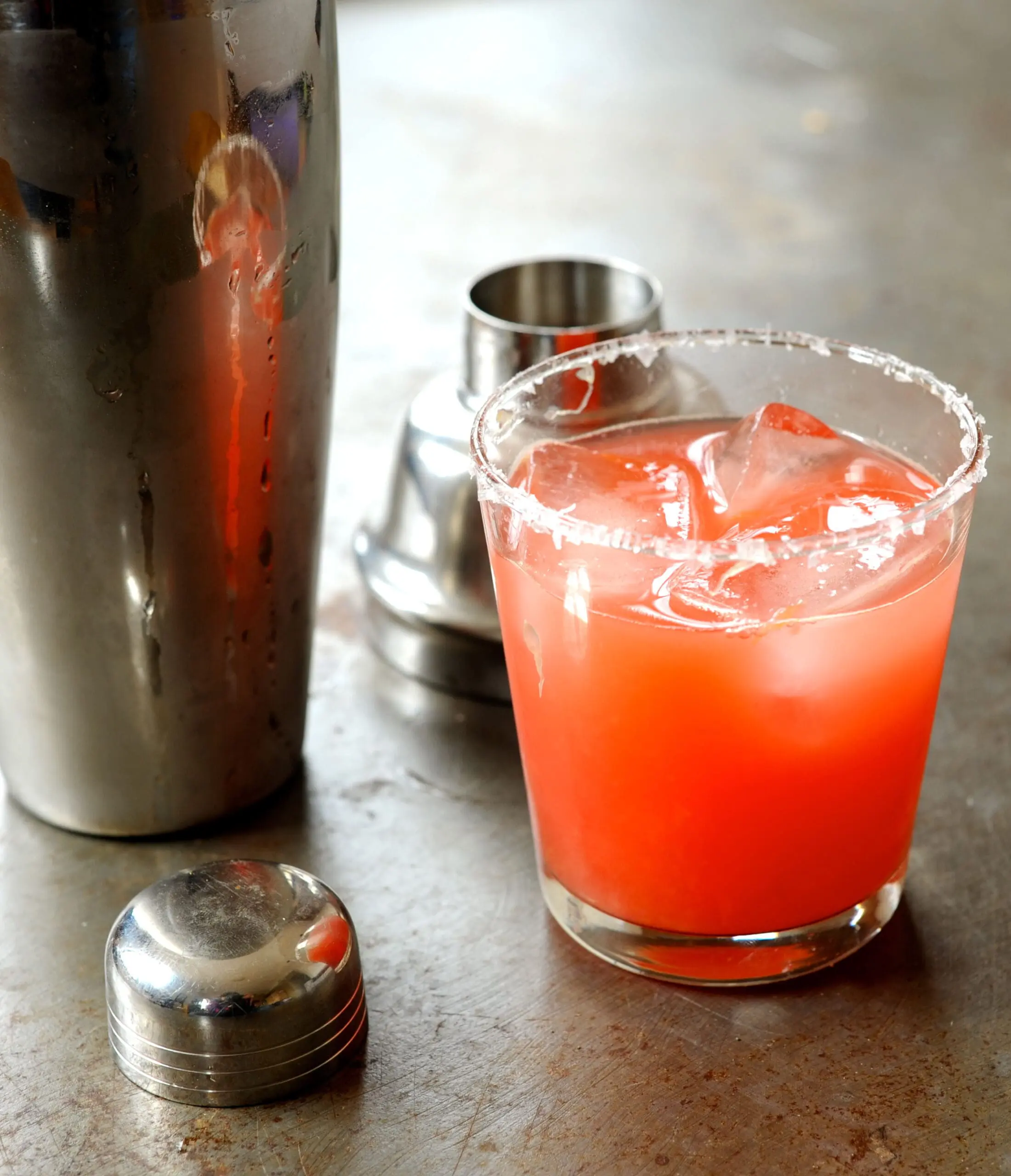blood orange margarita in cocktail glass with shaker. Here's how to make a margarita, blood orange margarita recipe with fresh ingredients.