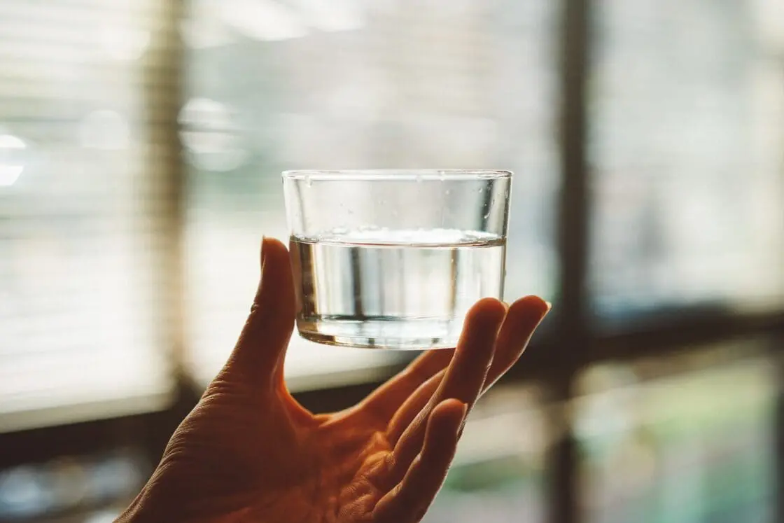 Holding glass of water