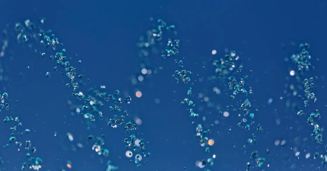 Floating molecules in blue water indicating the various ways to make collagen powder supplements.