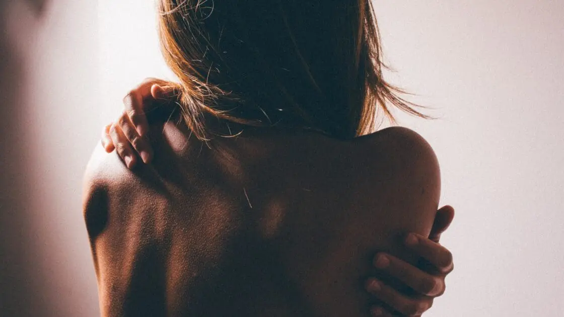 a tense body from the back