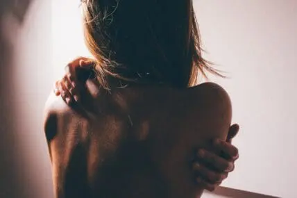 a tense body from the back