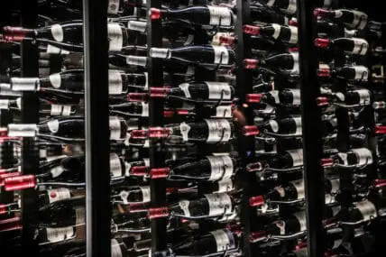 wine bottles on a rack from organic wine list for collecting