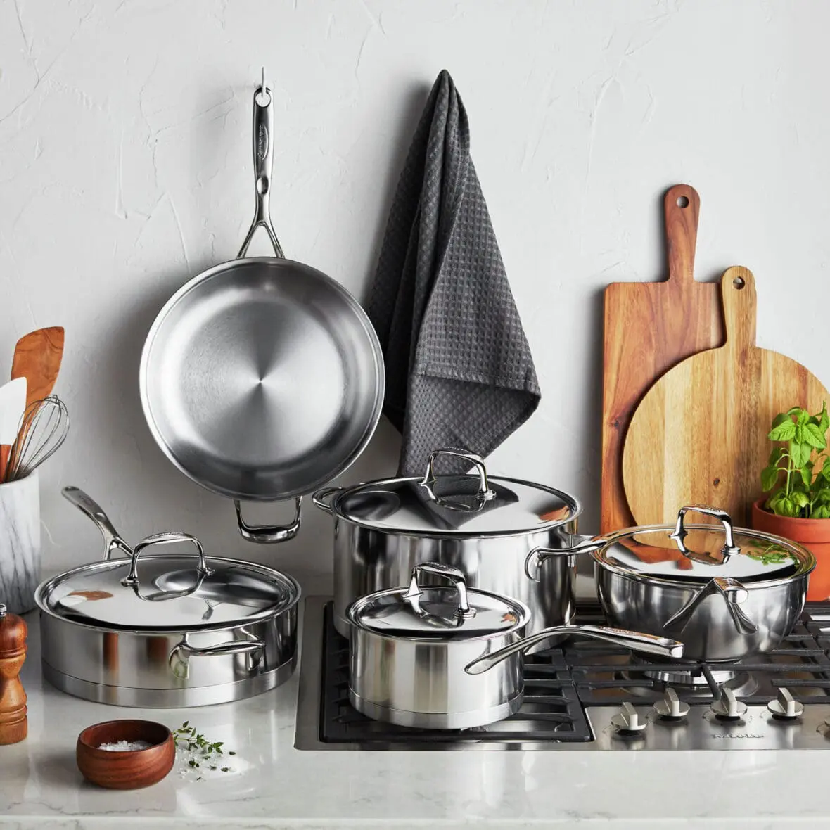 image of a Demeyere cookware set on a stove, all stainless steel