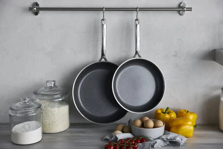 Image of GreenPan Spectra two-piece frypan set hanging in a kitchen.