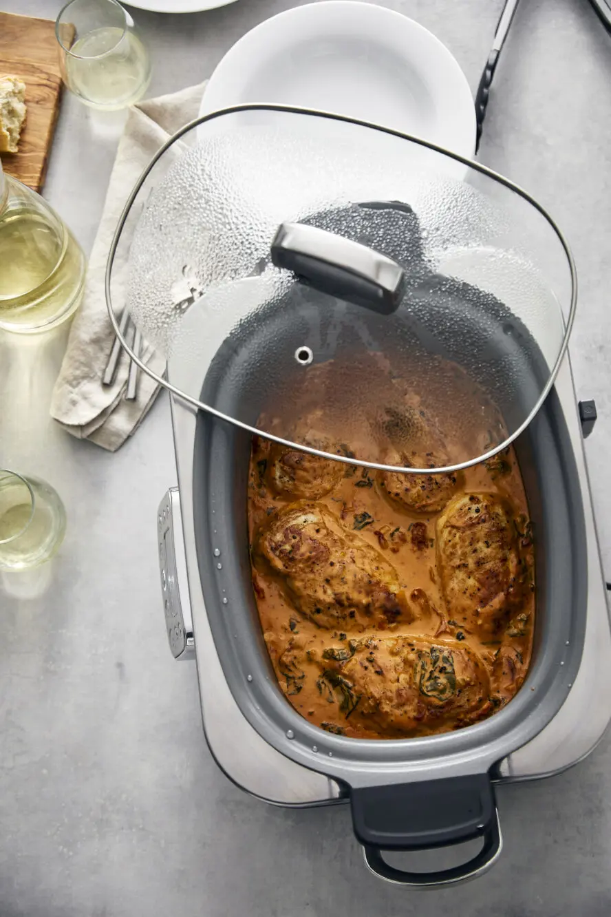 Image of the GreenPan Elite 14-in-1 slow cooker with savory, stewed chicken that's perfect for weeknight meals.