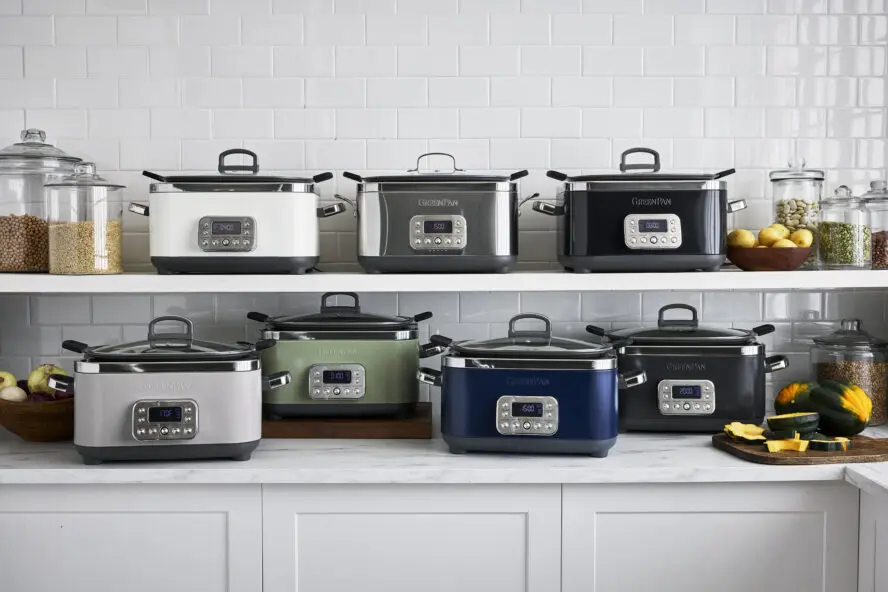 Image of the GreenPan Elite 14-in-1 slow cooker in all 7 colors available, displayed on a kitchen counter and shelf.