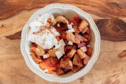 image of a sweet potato breakfast bowl served in a pretty bowl. This yummy bowl is super easy to put together.