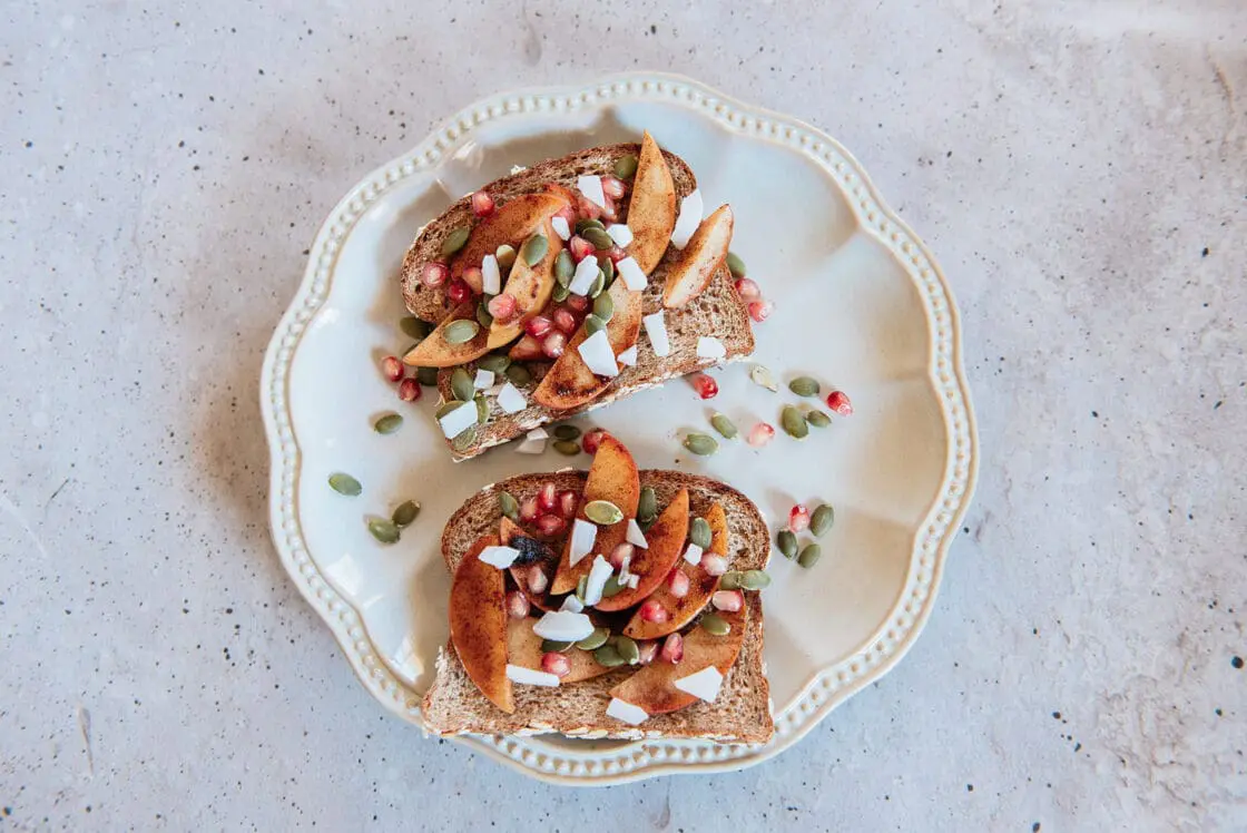 image of apple toast, which is easy to make, plated on a pretty plate ready to serve for breakfast, a snack, or simple dessert.