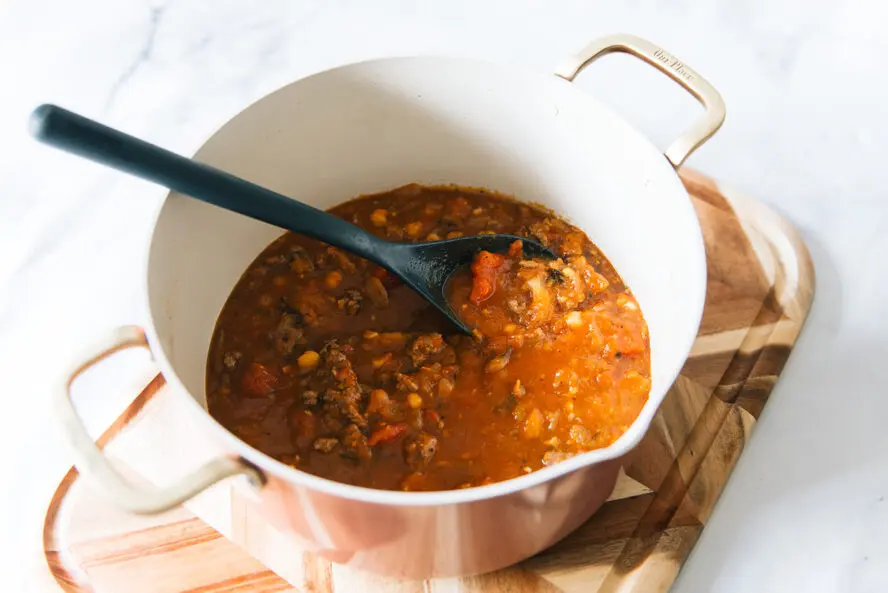 image of chili with butternut squash, chickpeas, and beef in an Our Place Essentials Dutch Oven