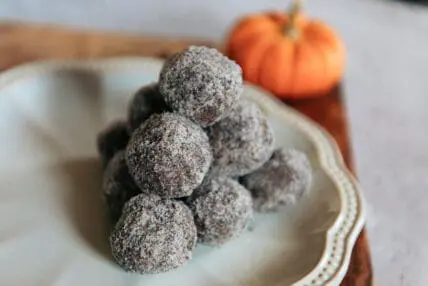 image of no bake pumpkin balls on a white plate