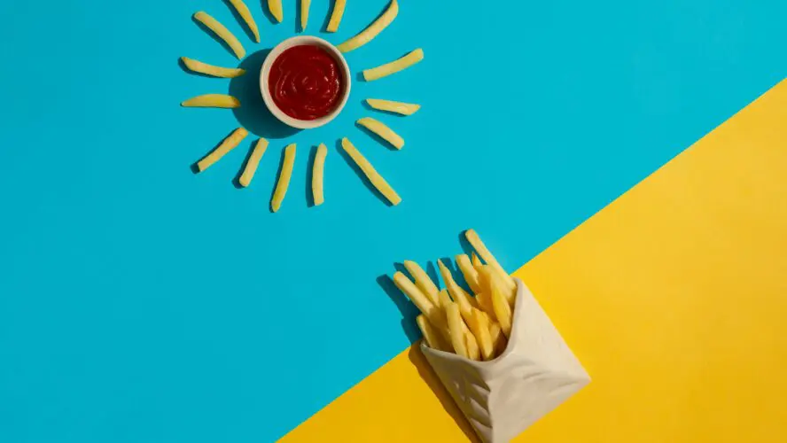 Image of french fries in the shape of sun rays surrounding ketchup. McDonalds Happy meals just got healthier aditya saxena unsplash