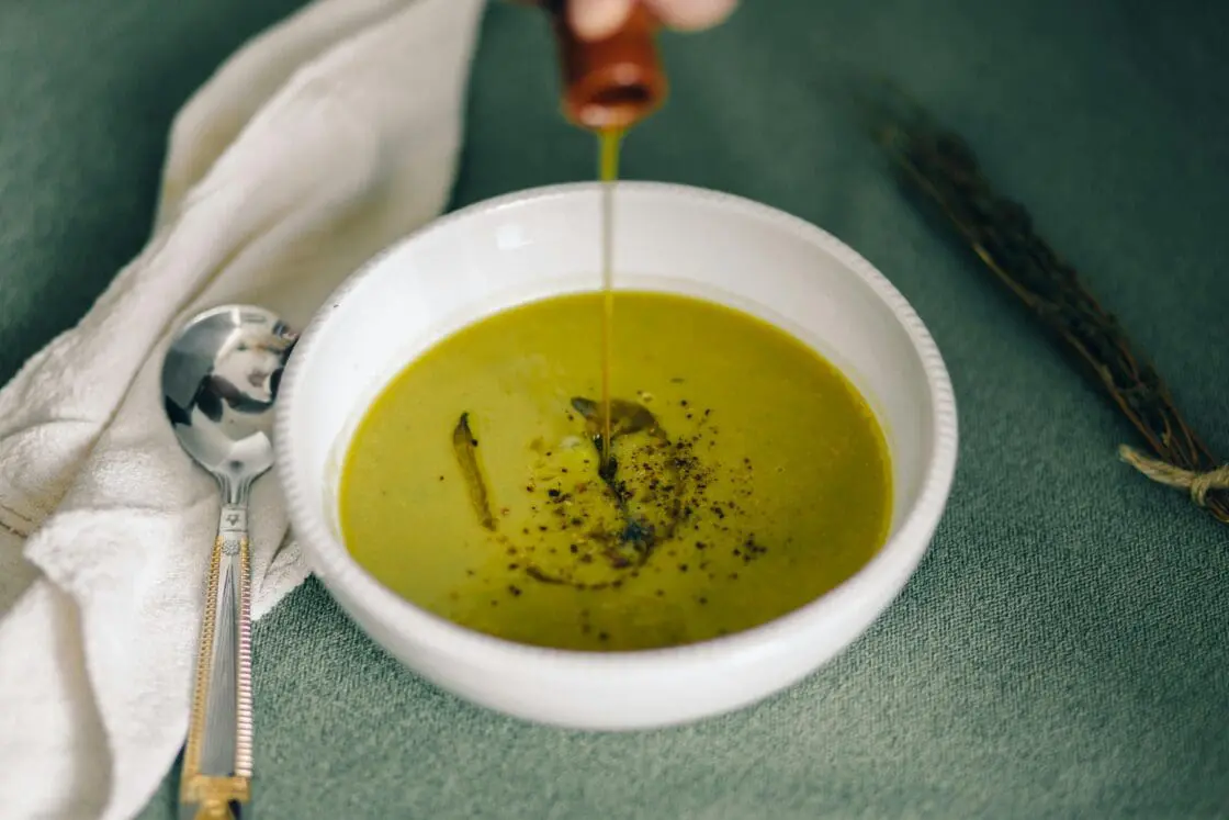 image of the type of olive oil benefits or medicinal olive oil being poured into a bowl