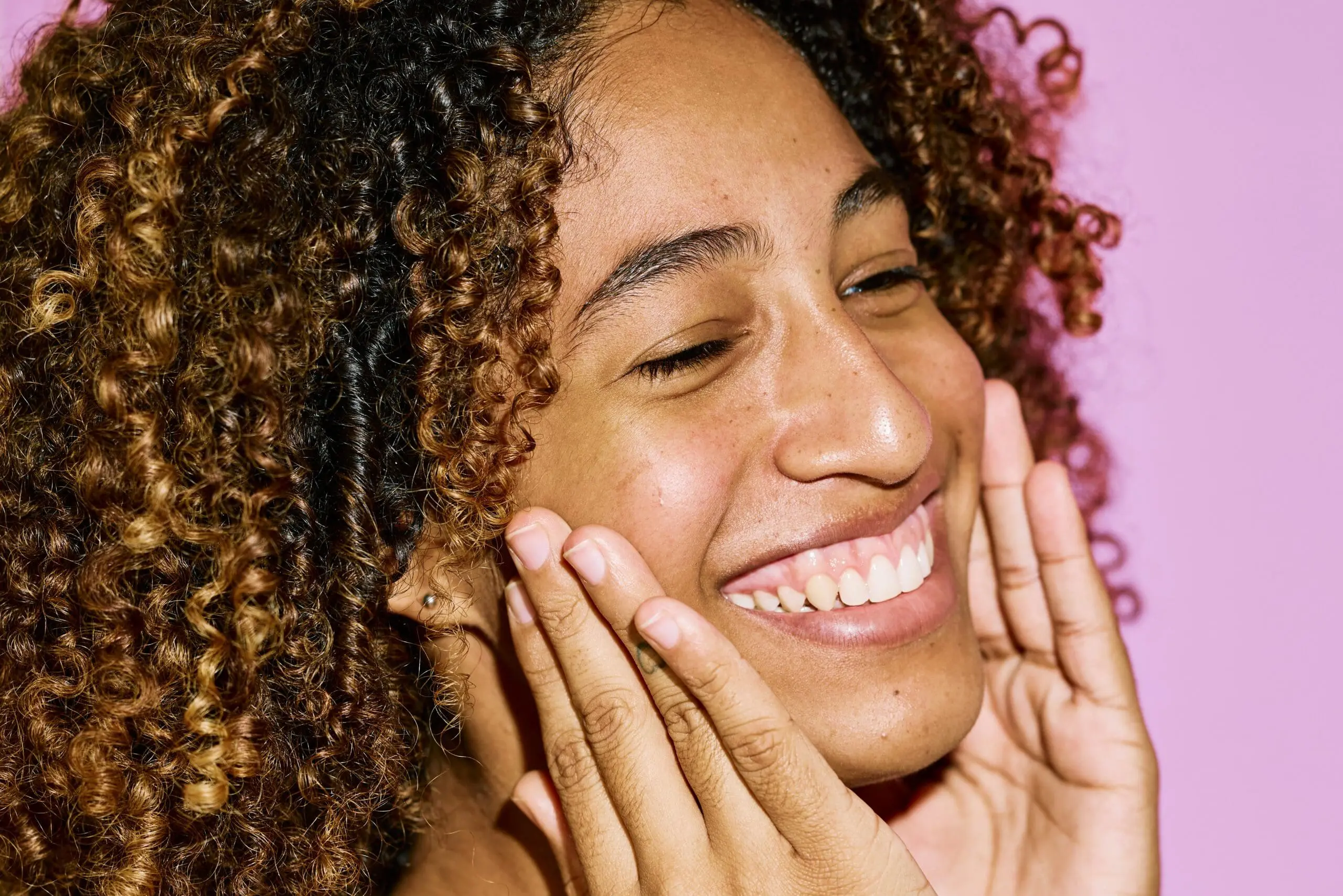 Image of woman with glowing skin as manuka honey is used for skincare and has many other uses besides.