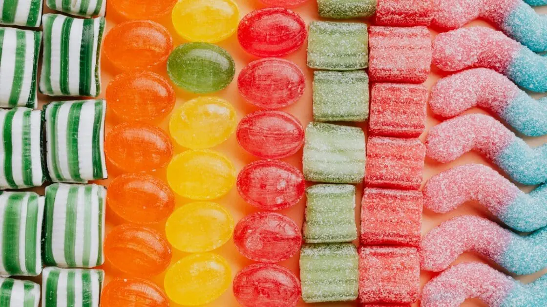 Image of several rows of colorful candies that make use of synthetic food dyes for their bright hues.