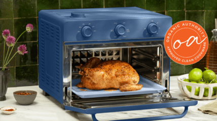 image of an Our Place Air Fryer used for review by a chef. Image has a full roasted chicken.