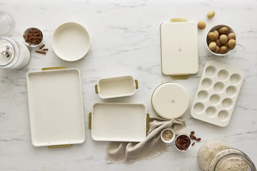 Image of the GreenPan Reserve Bakeware set in cream, laid out across a marble countertop.