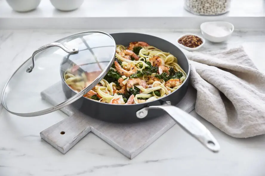 Image of a GreenPan Valencia Pro sauté pan with a giant lid, with a creamy prawn pasta.