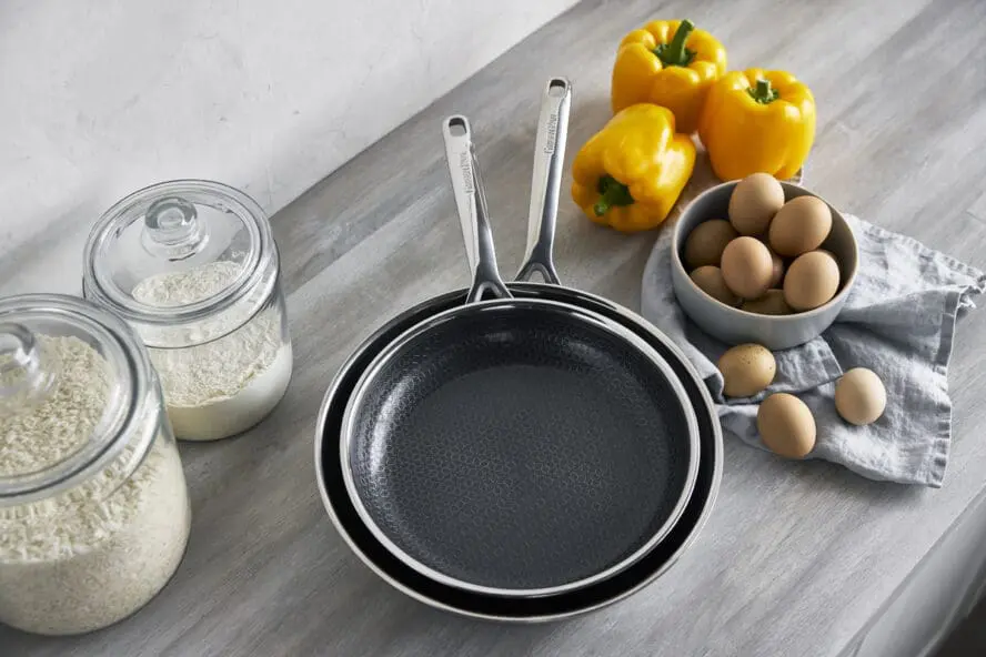 Image of the GreenPan Spectra frypan duo, nested in each other with the etched stainless steel surface showing.