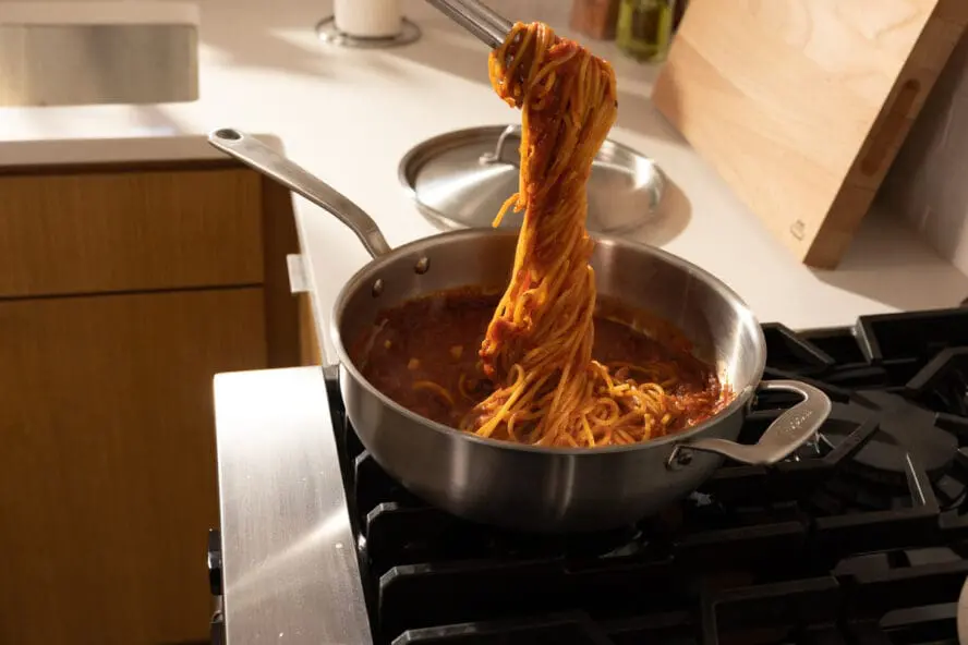 Image of spaghetti being made in a Made In stainless steel sauce pan.