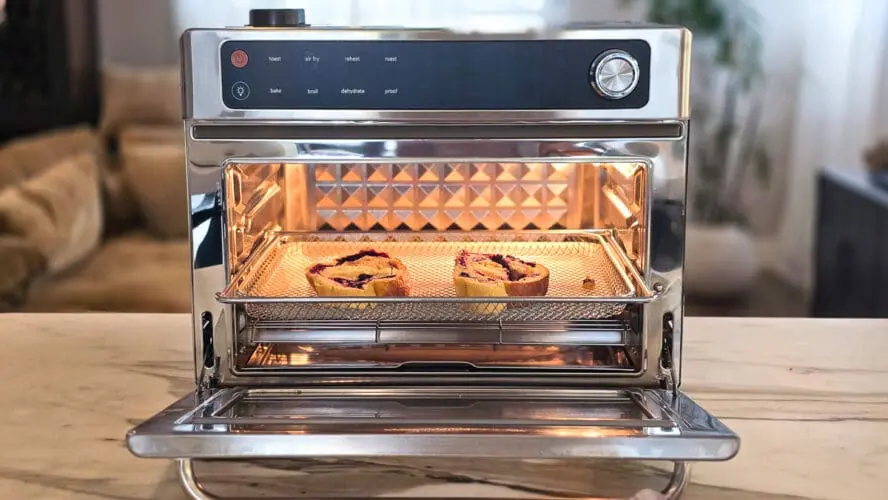 Image of the Our Place Wonder Oven Pro in stainless steel being used to toast two slices of bread.