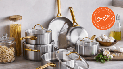 Image of pieces from the GreenPan Reserve Stainless Steel collection set against a wall in a modern kitchen with the Organic Authority Approved stamp.