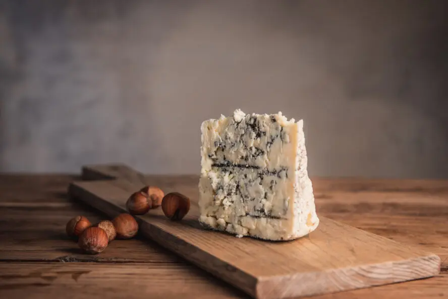 Image of a gorgeous wedge of Smokey Blue cheese from Rogue Creamery, Oregon.