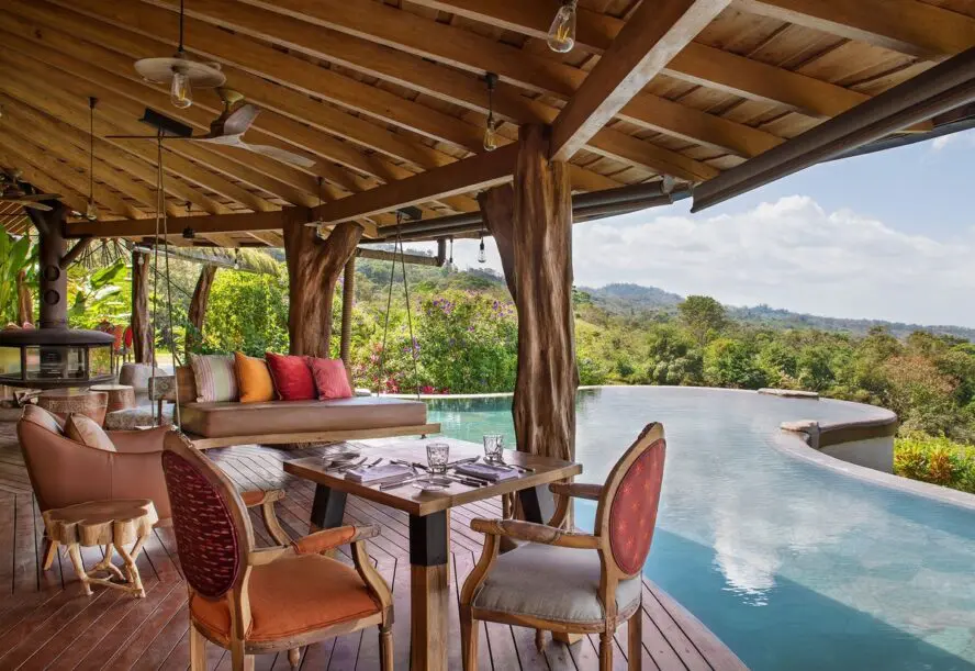 Image of Origins Floral's on-site restaurant and pool, overlooking the forest skyline.