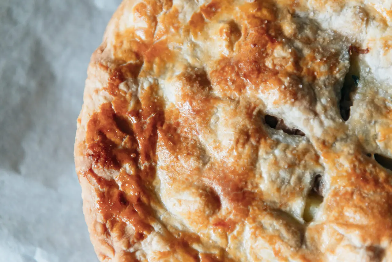 Image of a golden brown puff pastry pot pie.
