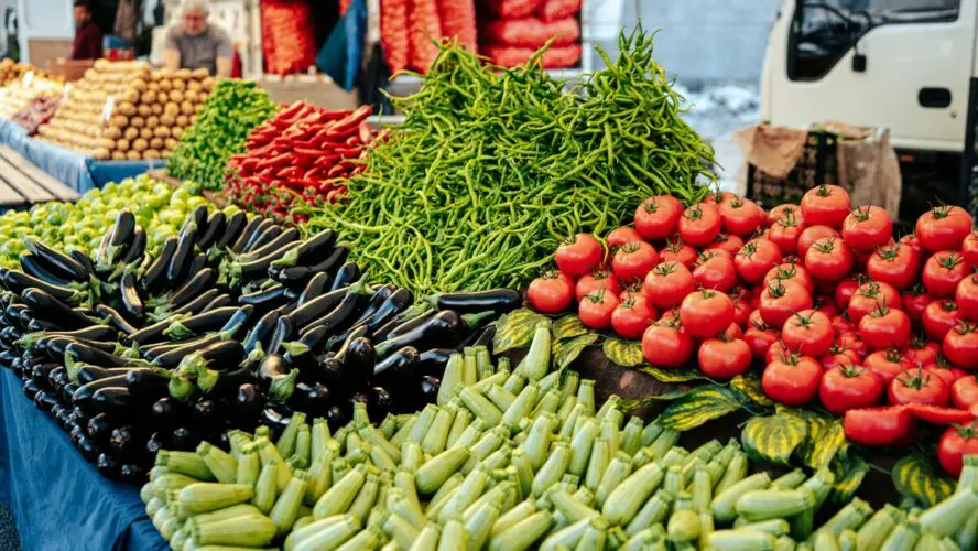 Image of a vibrant spread of produce on a farmer's market table.