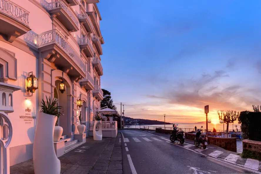 Image of the exterior of Hotel Mediterraneo Sorrento just before sunset.