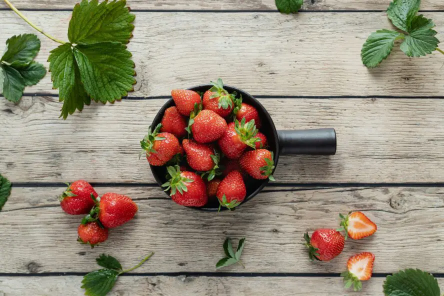 fresh strawberry for a strawberry cobbler recipe olivie strauss unsplash