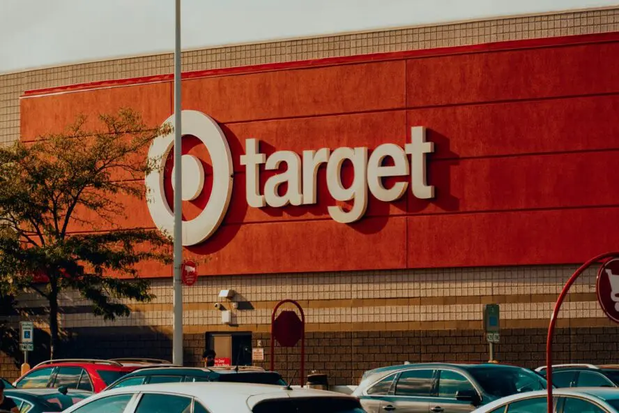 Image of the front of a large Target store, showing the huge sign shot from the parking lot.