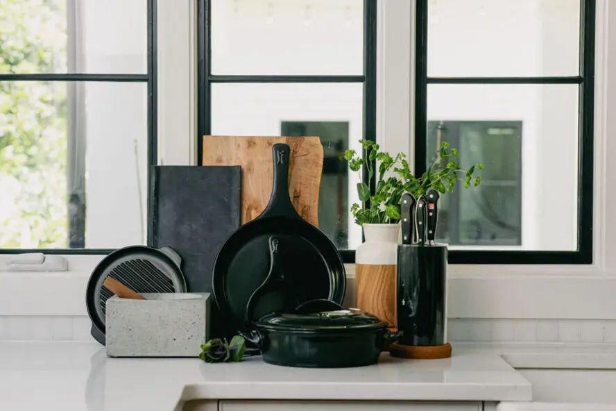 Image of several Xtrema pure ceramic pieces displayed against a window in a brightly lit kitchen.