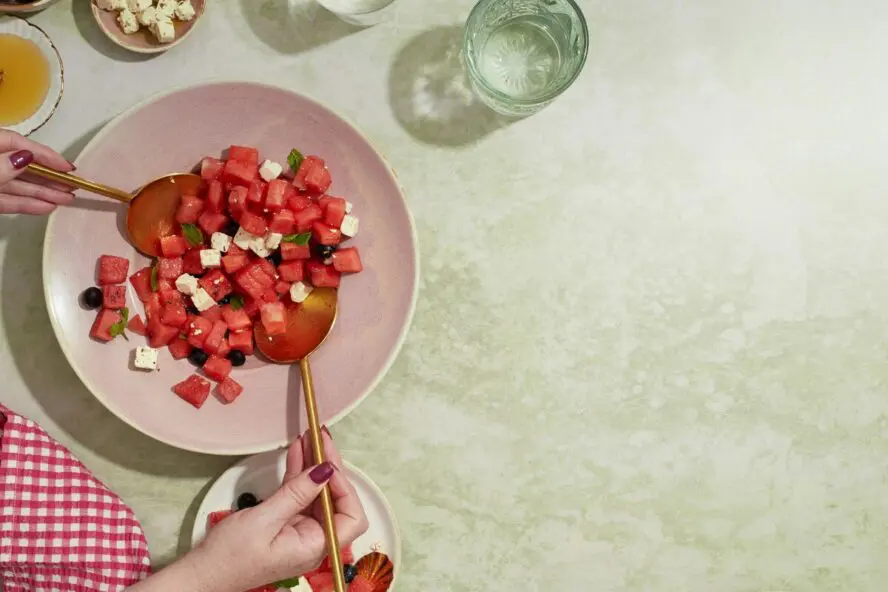 Image of a bowl full of cubed watermelon and feta mixed into a refreshing salad.