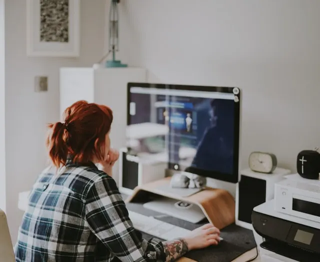 woman looking at computer sreen