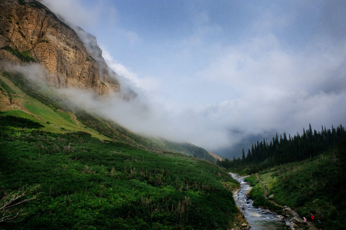 mountains with fog, and wandering stream