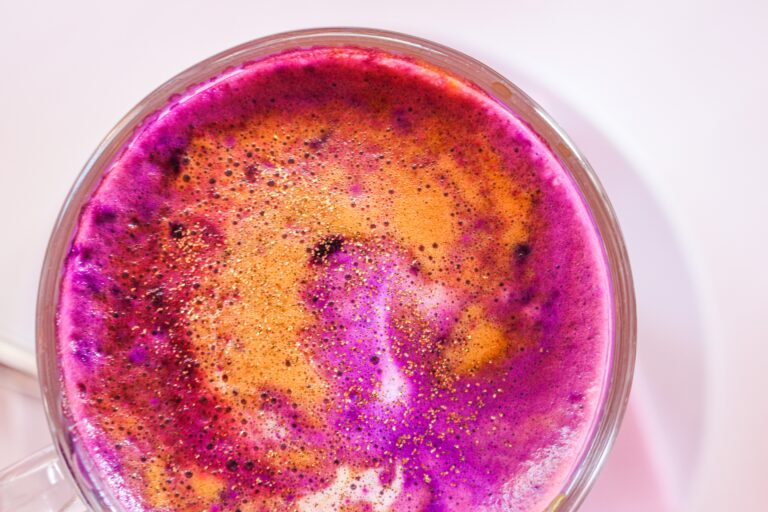 Vibrant purple and orange juice or smoothie that contains marine collagen supplements.