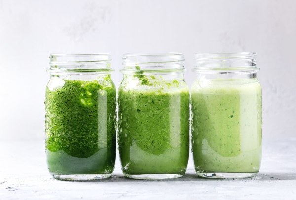 Image of three jars filled with green drinks on a kitchen counter. Your guide to the best greens powders and supplements. The best greens powder may help supplement any gaps in your diet. Greens powders can be a useful tool in any wellness kit. Most greens powders can help up your nutrition game. In our busy world, it's hard getting all your fruits and vegetables in daily.