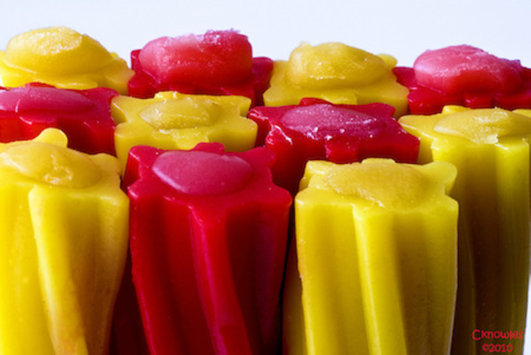 Red and yellow bell peppers with water droplets